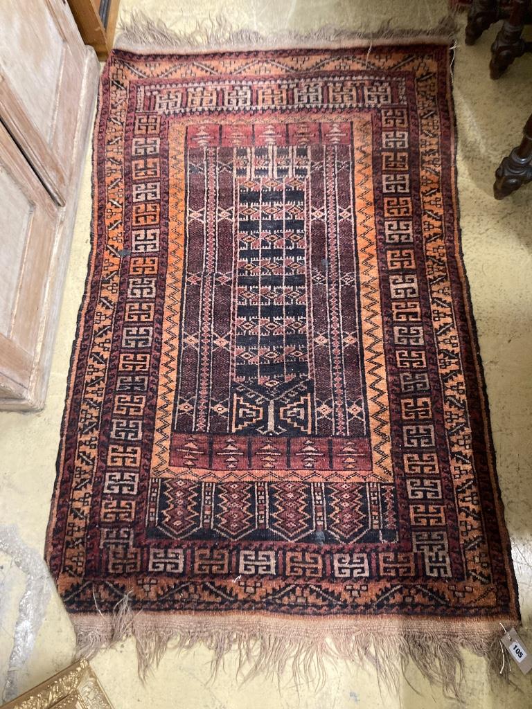A Belouch red rug, 135 x 87cm